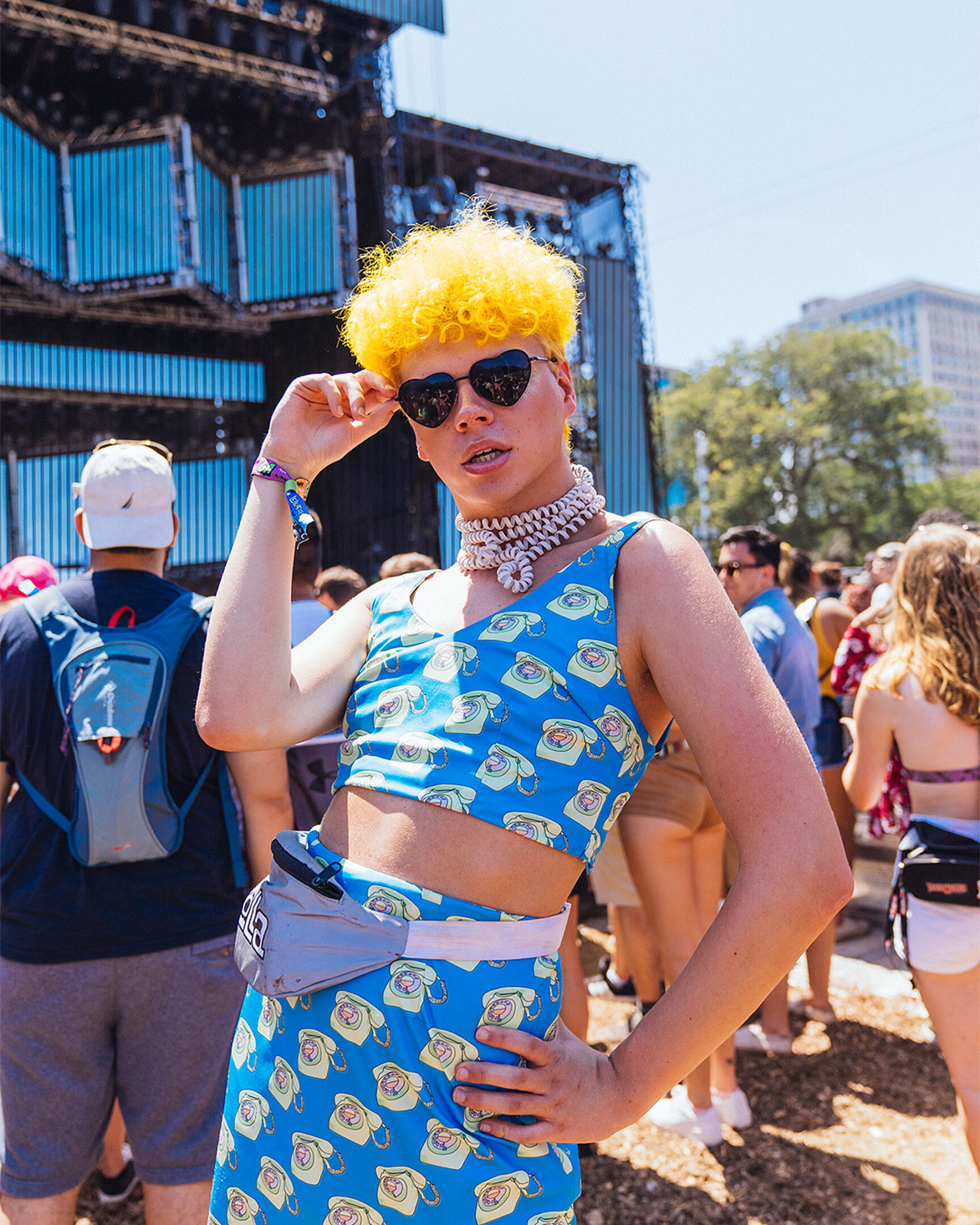 stylish person holding their sunglasses