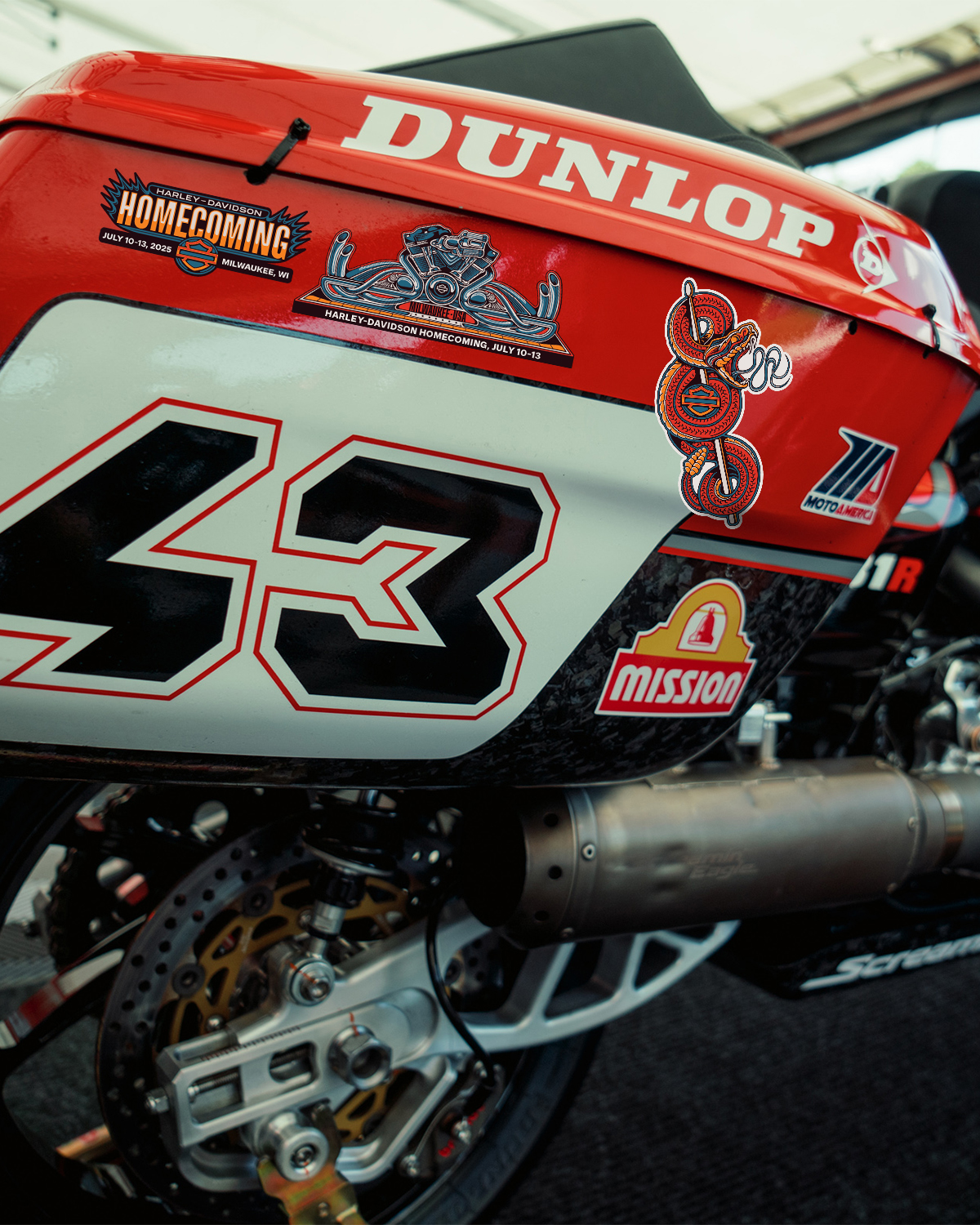 branded stickers on the side of a motorcycle