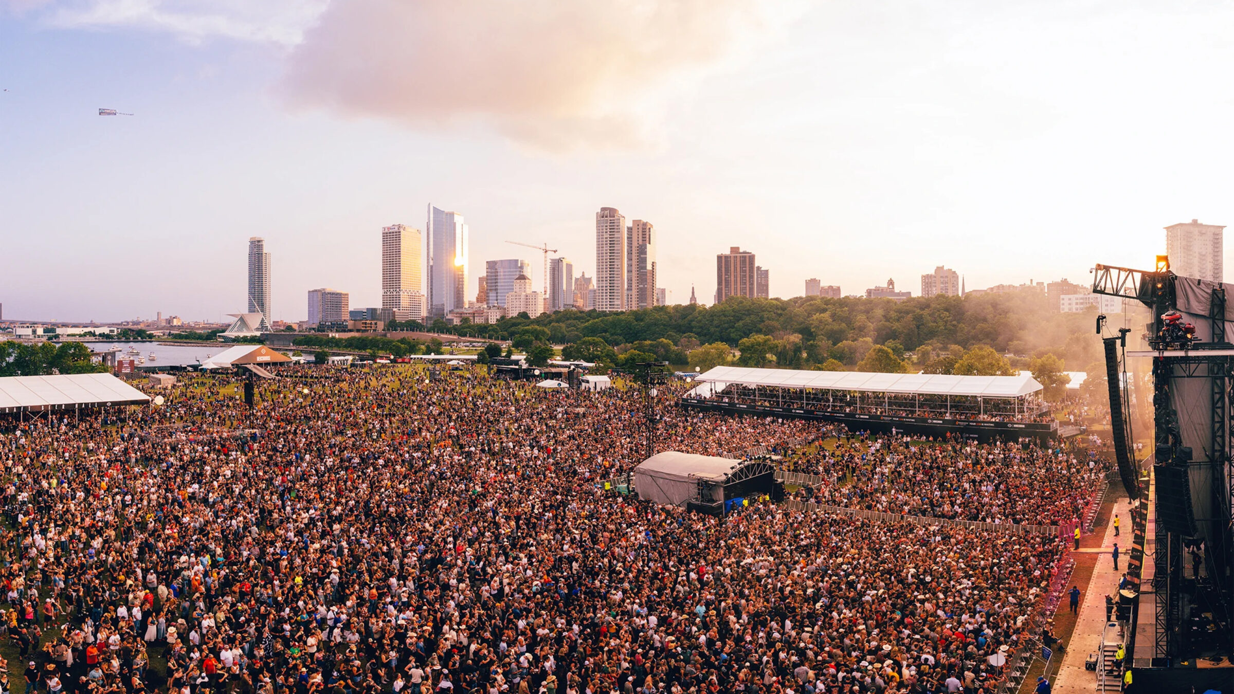 wide shot of the massive crowd of people with a skyline in the background